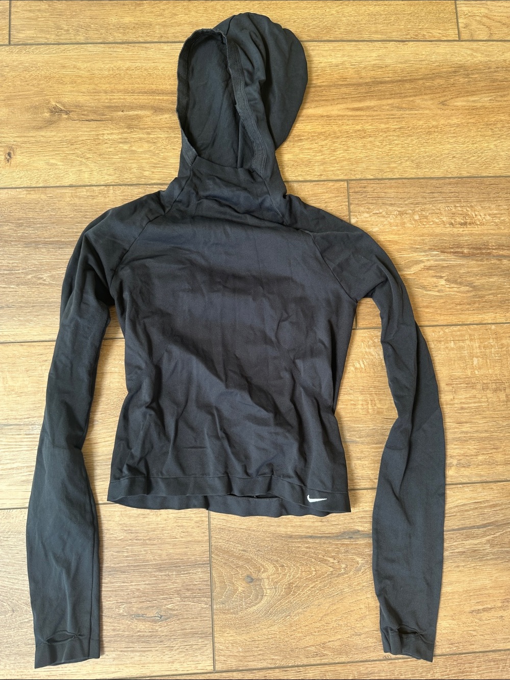 Nike Black Long-Sleeve Cropped Athletic Top with White Swoosh